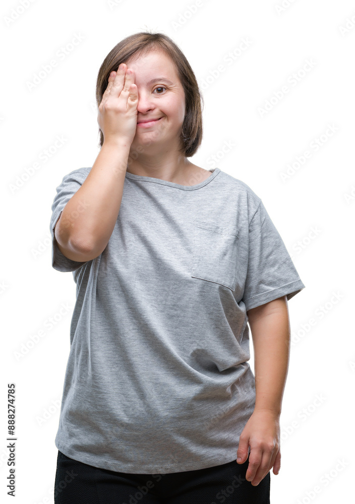 Young adult woman with down syndrome over isolated background covering one eye with hand with confident smile on face and surprise emotion. Young adult woman with down syndrome over isolated background covering one eye with hand with confident smile on face and surprise emotion.