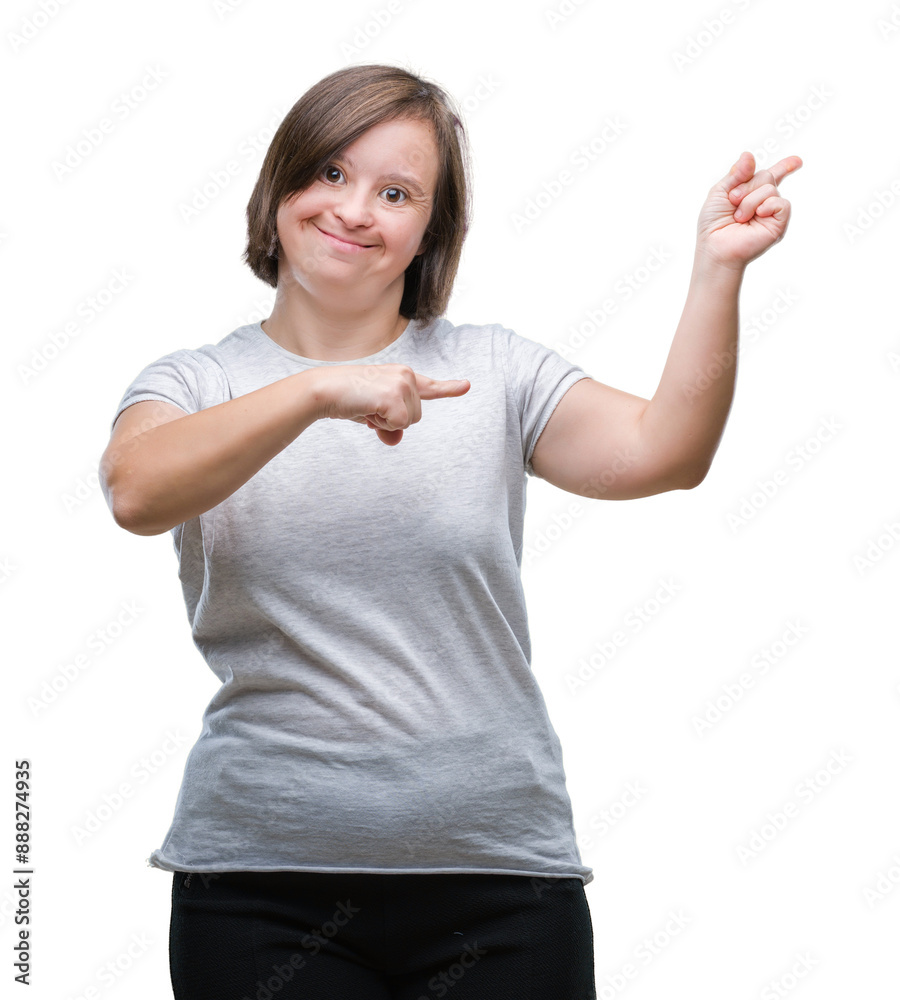 Young adult woman with down syndrome over isolated background smiling and looking at the camera pointing with two hands and fingers to the side. Young adult woman with down syndrome over isolated background smiling and looking at the camera pointing with two hands and fingers to the side.