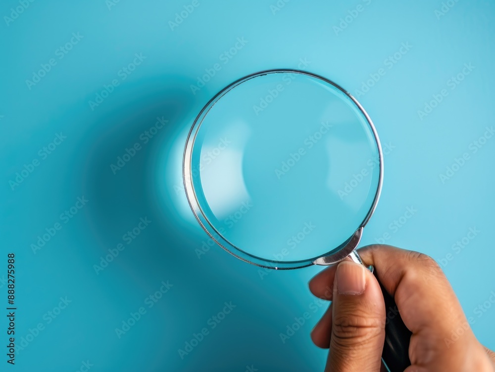 Close-up of hands using magnifying glass, suitable for investigation or educational images Close-up of hands using magnifying glass, suitable for investigation or educational images