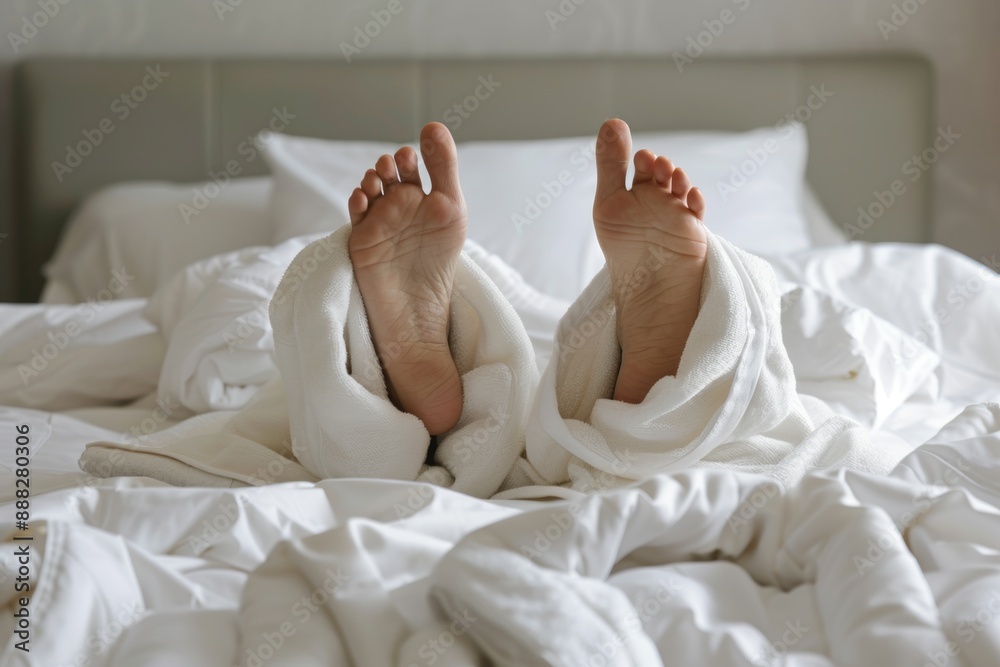 Hands of woman sleeping in a hotel robe and showing thumbs up at the bedroom signifying gestures, comfort, and good morning Hands of woman sleeping in a hotel robe and showing thumbs up at the bedroom signifying gestures, comfort, and good morning
