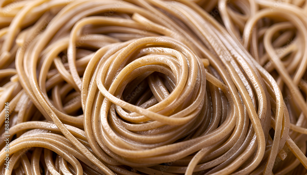 Uncooked buckwheat noodles (soba) as background, top view Uncooked buckwheat noodles (soba) as background, top view
