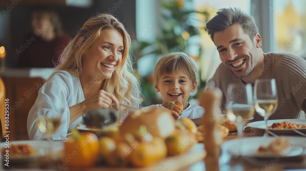 Happy family enjoying a meal together at home Happy family enjoying a meal together at home