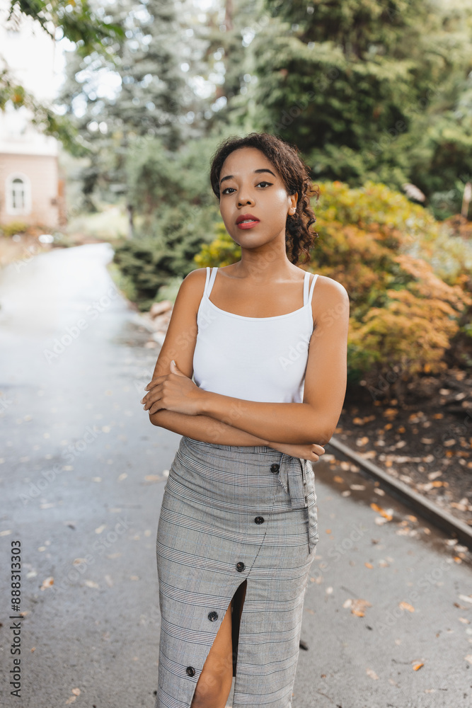 Confident Woman in Stylish Outfit Posing Outdoors in Fall Confident Woman in Stylish Outfit Posing Outdoors in Fall