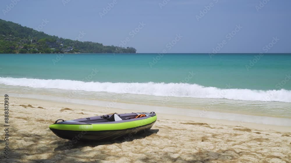 Serene Kamala Beach with turquoise waters and inflatable kayak on pristine sand, Phuket, Thailand Serene Kamala Beach with turquoise waters and inflatable kayak on pristine sand, Phuket, Thailand