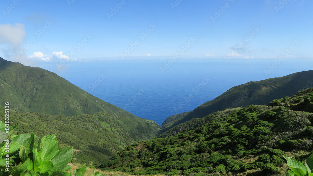 Obraz premium View of the hiking trail starting in Serra do Topo - Caldeira Santo Cristo - Fajã dos Cubres in São Jorge island, Azores, Portugal.