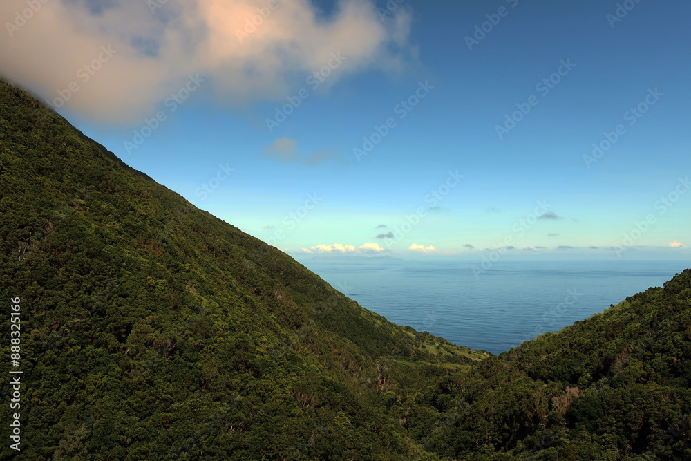 Obraz premium View of the hiking trail starting in Serra do Topo - Caldeira Santo Cristo - Fajã dos Cubres in São Jorge island, Azores, Portugal.