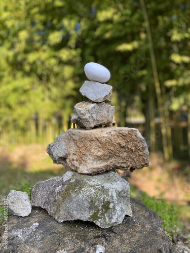 Creating a tranquilityinducing Balancing Stones Pyramid with an Egg in the midst of nature