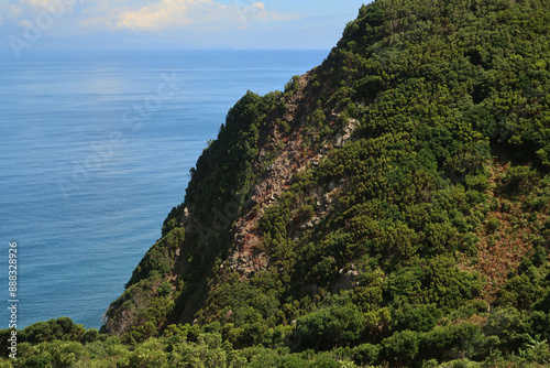 View of the hiking trail starting in Serra do Topo - Caldeira Santo Cristo - Fajã dos Cubres in São Jorge island, Azores, Portugal. photo