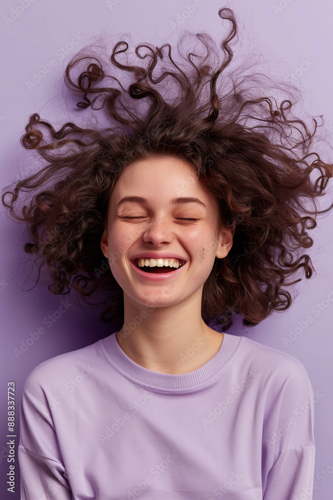 Joyful young woman with curly hair, captured in a playful and carefree moment with a radiant smile against a bright backdrop. Joyful young woman with curly hair, captured in a playful and carefree moment with a radiant smile against a bright backdrop.