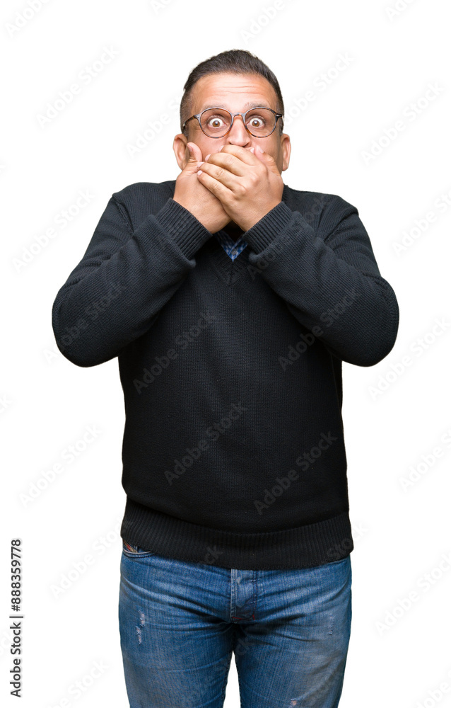 Middle age bussines arab man wearing glasses over isolated background shocked covering mouth with hands for mistake. Secret concept. Middle age bussines arab man wearing glasses over isolated background shocked covering mouth with hands for mistake. Secret concept.