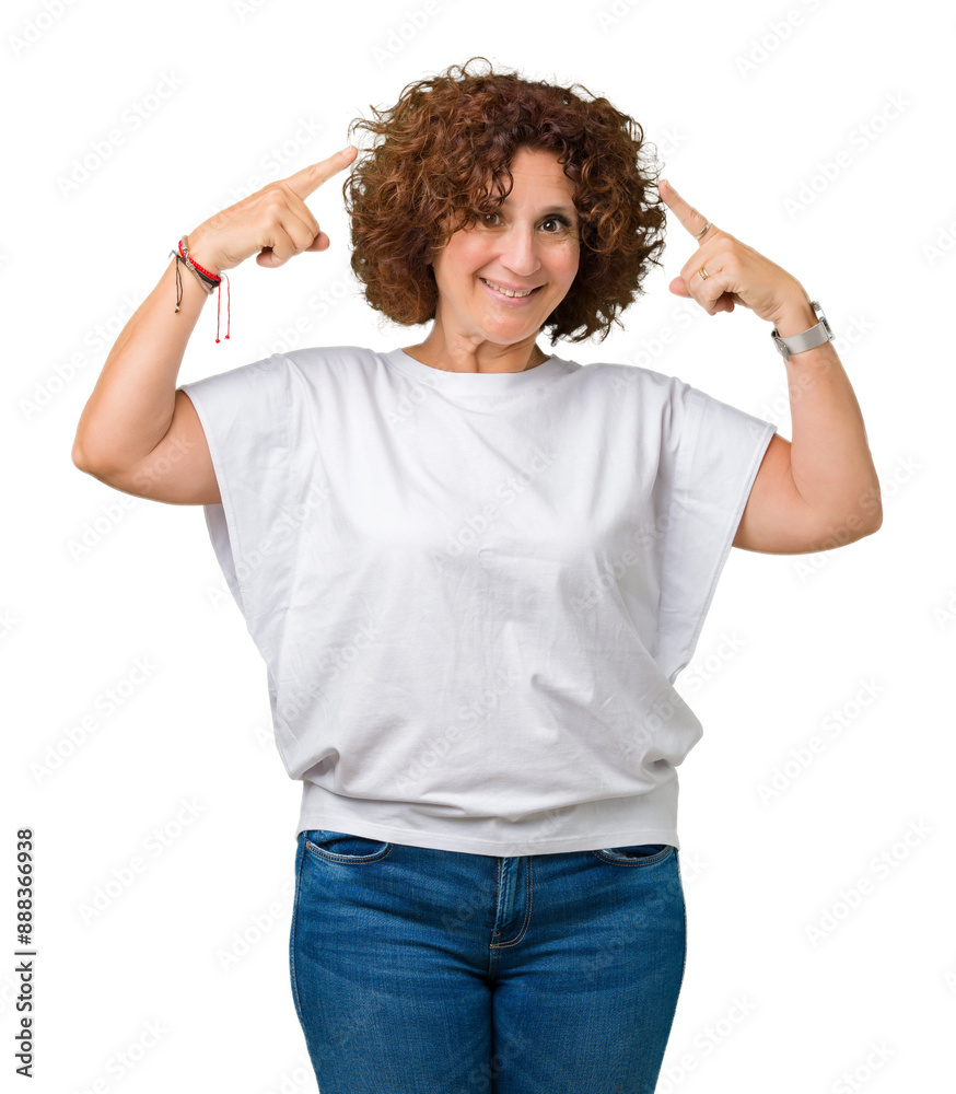 Beautiful middle ager senior woman wearing white t-shirt over isolated background Smiling pointing to head with both hands finger, great idea or thought, good memory Beautiful middle ager senior woman wearing white t-shirt over isolated background Smiling pointing to head with both hands finger, great idea or thought, good memory