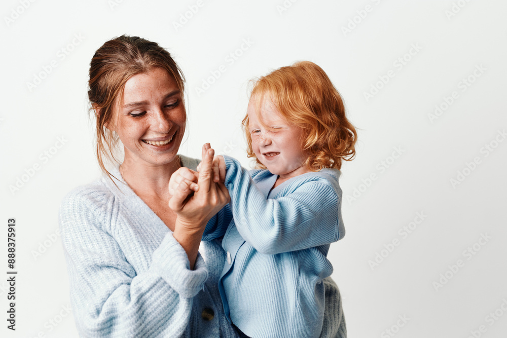 Joyful moment mother and daughter bonding through play and laughter on a white background Joyful moment mother and daughter bonding through play and laughter on a white background