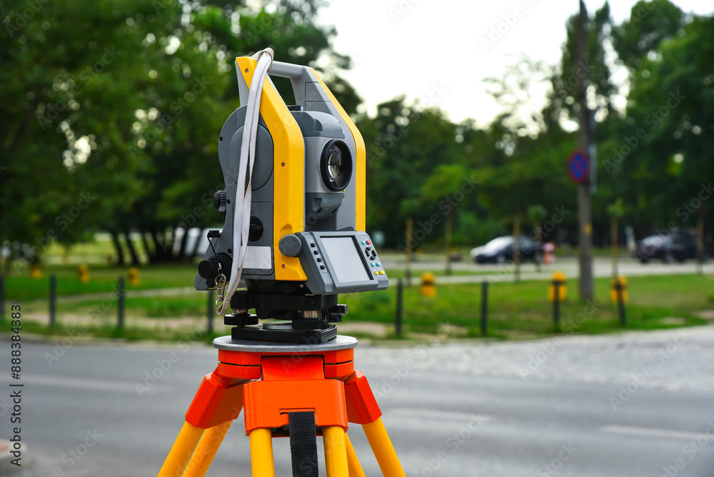 Geodetic electronic device theodelit on a tripod. Geodetic work on the ground, measuring the area of the territory, geodesy, level, construction. Geodetic electronic device theodelit on a tripod. Geodetic work on the ground, measuring the area of the territory, geodesy, level, construction.