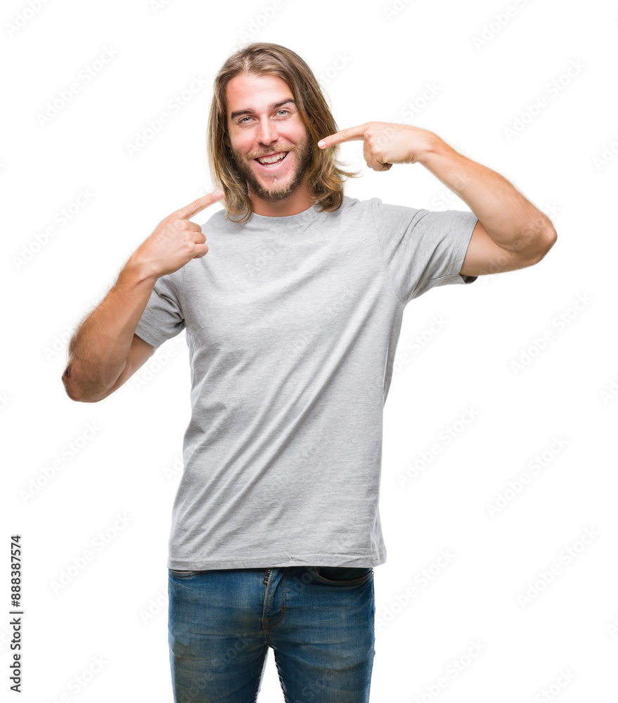 Young handsome man with long hair over isolated background smiling confident showing and pointing with fingers teeth and mouth. Health concept. Young handsome man with long hair over isolated background smiling confident showing and pointing with fingers teeth and mouth. Health concept.