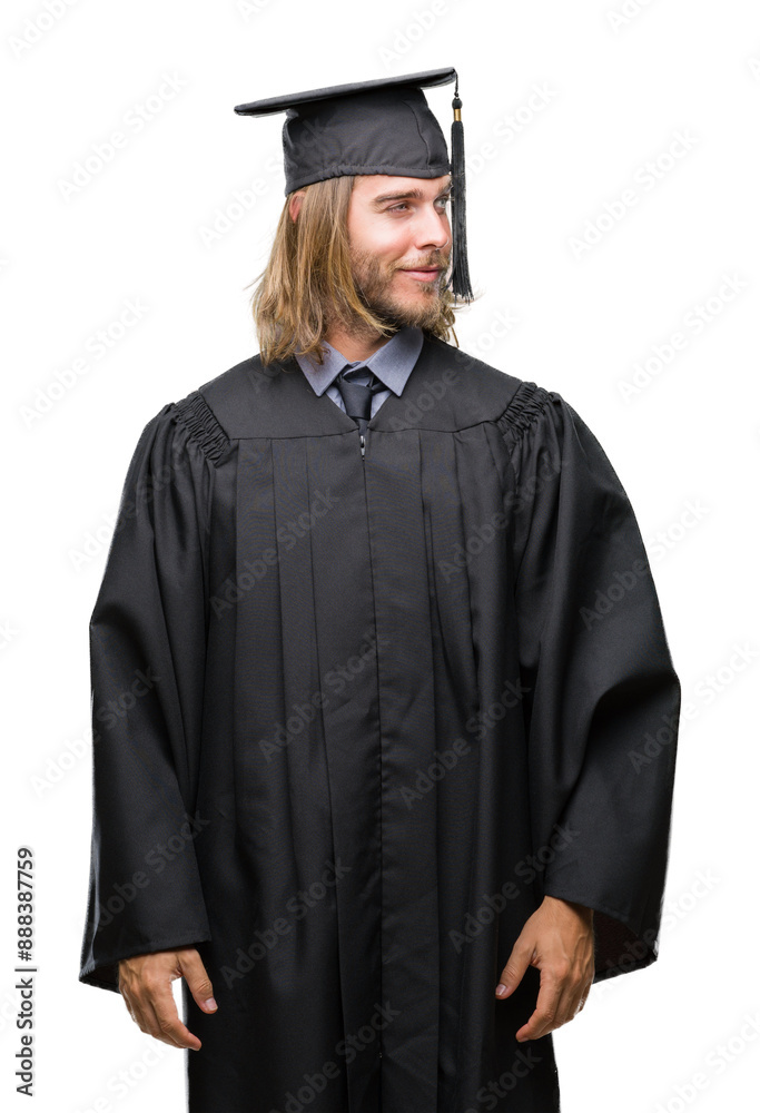 Young handsome graduated man with long hair over isolated background smiling looking side and staring away thinking. Young handsome graduated man with long hair over isolated background smiling looking side and staring away thinking.