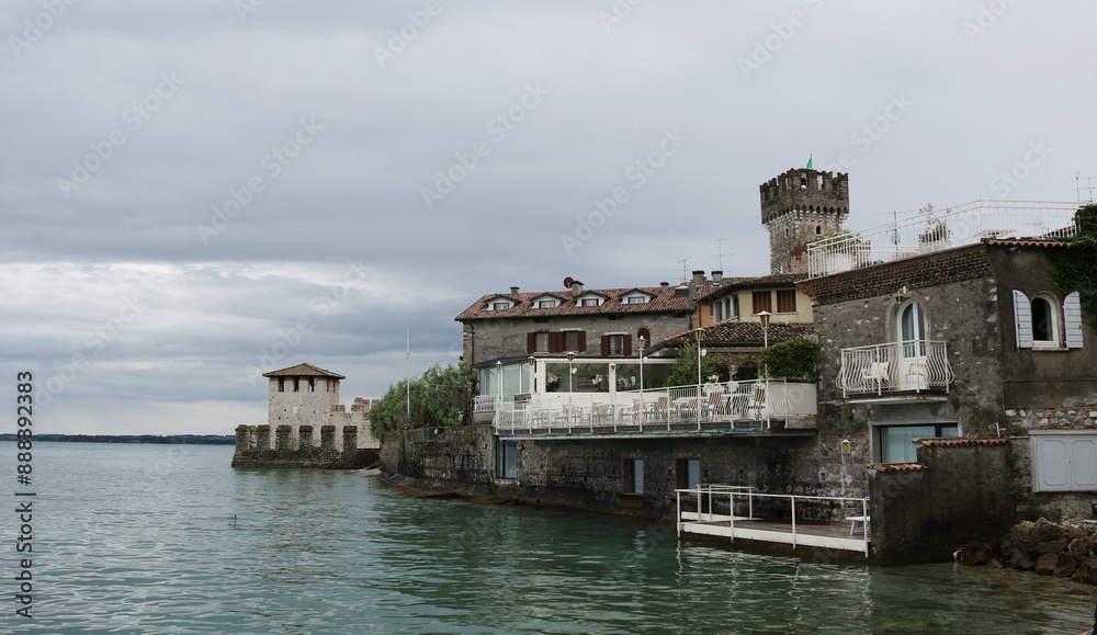 Scaliger castle in the historical center of Sirmione town near Garda lake in Italy. Scaliger castle in the historical center of Sirmione town near Garda lake in Italy.