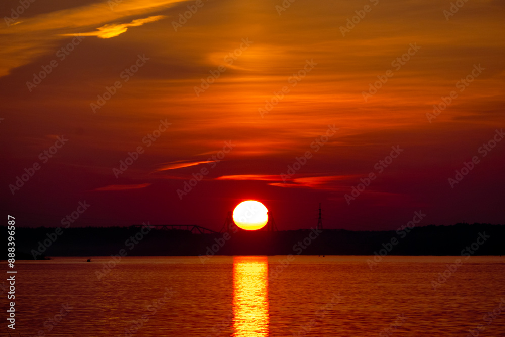 Golden sunset on the beach at neva river in saint-petersburg, russia. Tranquil scene. Nature background. Landscape. High quality photo