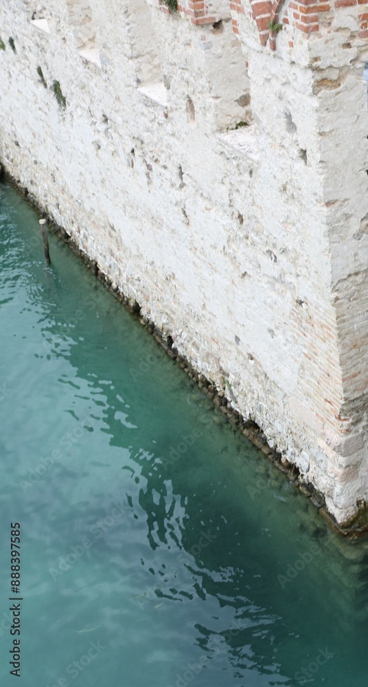 Scaliger castle in the historical center of Sirmione town near Garda lake in Italy. Scaliger castle in the historical center of Sirmione town near Garda lake in Italy.