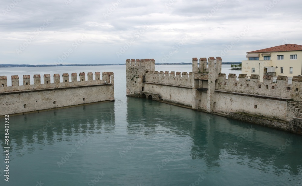 Scaliger castle in the historical center of Sirmione town near Garda lake in Italy. Scaliger castle in the historical center of Sirmione town near Garda lake in Italy.