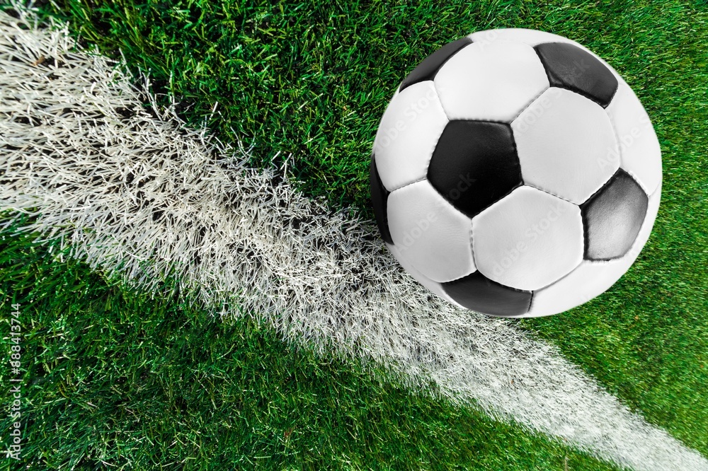 Classic football soccer ball on grass Classic football soccer ball on grass