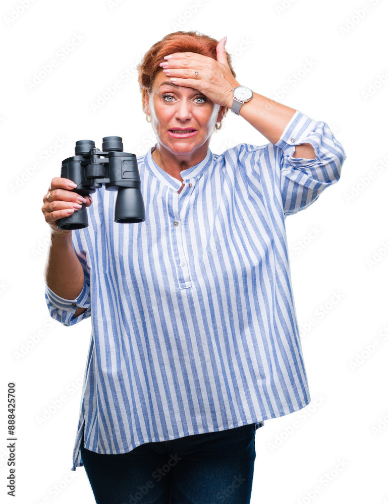 Senior caucasian woman looking through binoculars over isolated background stressed with hand on head, shocked with shame and surprise face, angry and frustrated. Fear and upset for mistake. Senior caucasian woman looking through binoculars over isolated background stressed with hand on head, shocked with shame and surprise face, angry and frustrated. Fear and upset for mistake.