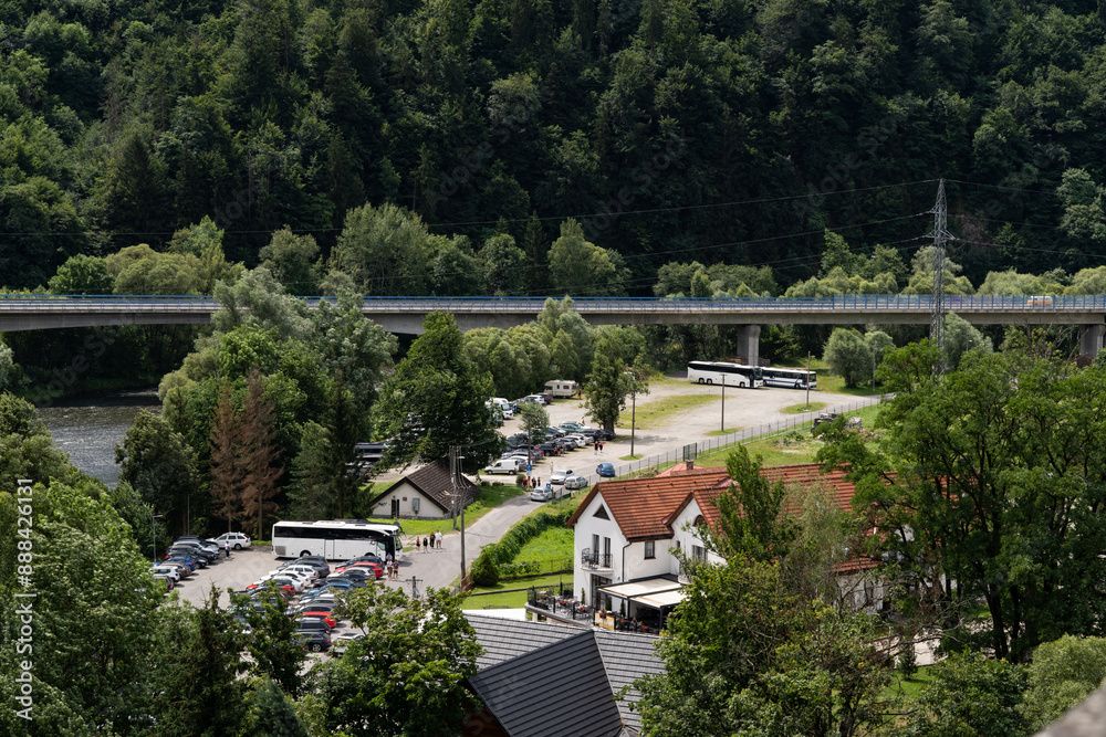 Fototapeta premium Small town surrounded by mountains in a summer landscape