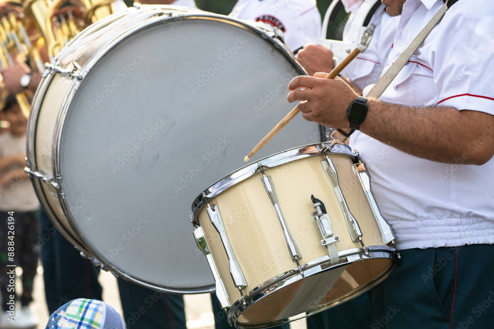 Fototapeta premium a police choir playing drum during a march at state events