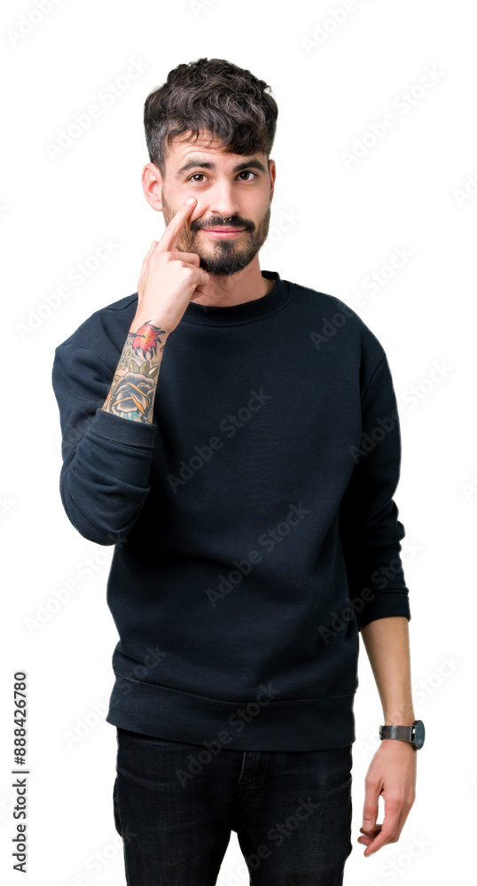 Young handsome man over isolated background Pointing to the eye watching you gesture, suspicious expression Young handsome man over isolated background Pointing to the eye watching you gesture, suspicious expression