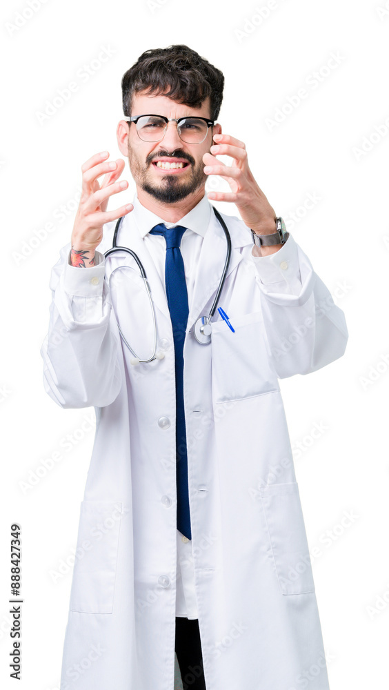 Young doctor man wearing hospital coat over isolated background Shouting frustrated with rage, hands trying to strangle, yelling mad Young doctor man wearing hospital coat over isolated background Shouting frustrated with rage, hands trying to strangle, yelling mad