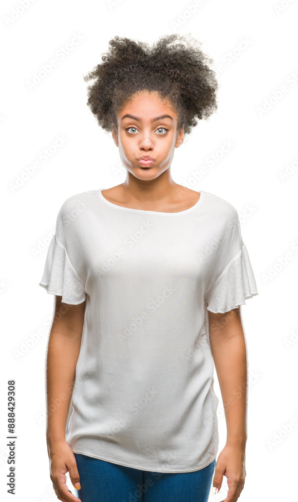 Young afro american woman over isolated background puffing cheeks with funny face. Mouth inflated with air, crazy expression. Young afro american woman over isolated background puffing cheeks with funny face. Mouth inflated with air, crazy expression.