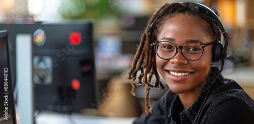 Smiling Customer Service Representative Wearing Headphones and Glasses in Office