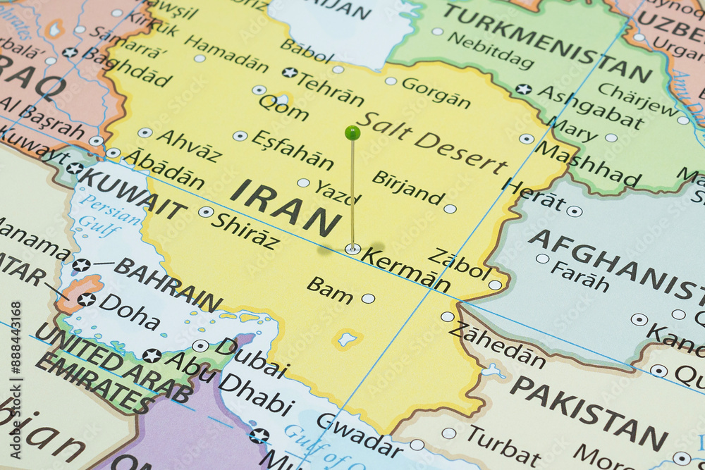 Close up to a Kerman city with a green pin needle into Iran country political map Close up to a Kerman city with a green pin needle into Iran country political map