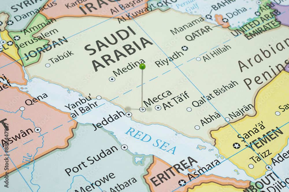 Close up to a Mecca city with a green pin needle into Saudi Arabia country political map 