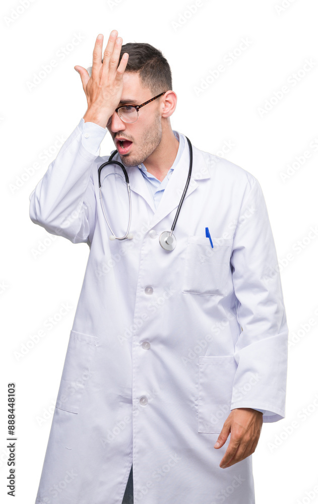 Handsome young doctor man surprised with hand on head for mistake, remember error. Forgot, bad memory concept. Handsome young doctor man surprised with hand on head for mistake, remember error. Forgot, bad memory concept.