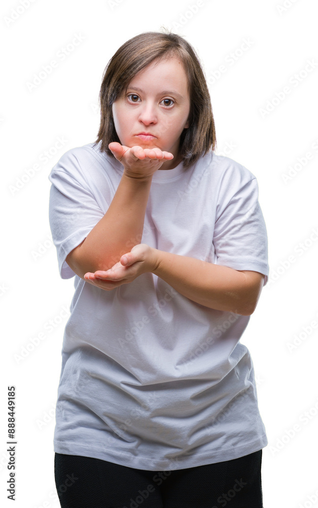 Young adult woman with down syndrome over isolated background looking at the camera blowing a kiss with hand on air being lovely and sexy. Love expression. Young adult woman with down syndrome over isolated background looking at the camera blowing a kiss with hand on air being lovely and sexy. Love expression.