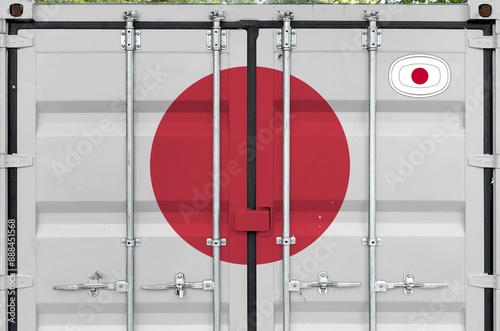 Photography Japan flag depicted on metal doors of shipping cargo container outdoors in docks