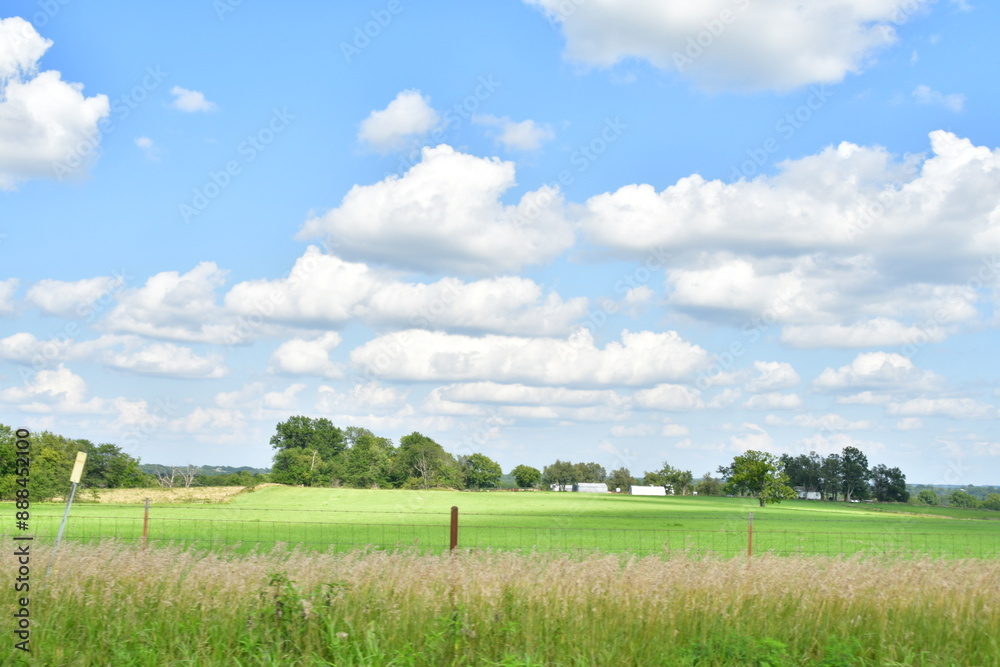 Clouds in a Blue Sky Over a Farm Field Clouds in a Blue Sky Over a Farm Field