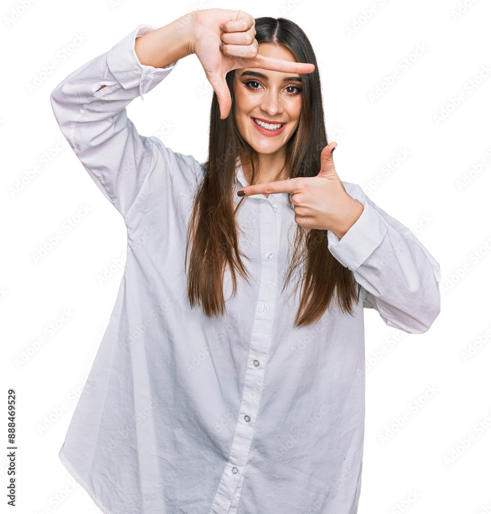 Young beautiful woman wearing casual white shirt smiling making frame with hands and fingers with happy face. creativity and photography concept. Young beautiful woman wearing casual white shirt smiling making frame with hands and fingers with happy face. creativity and photography concept.