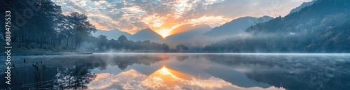 Misty Mountain Sunrise Reflecting on a Still Lake