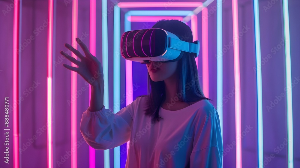 Young woman wearing VR glasses and gesturing Young woman wearing VR glasses and gesturing