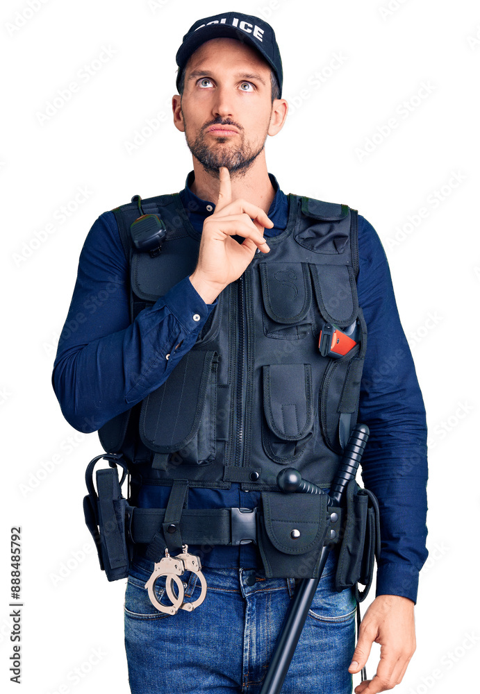 Young handsome man wearing police uniform thinking concentrated about doubt with finger on chin and looking up wondering