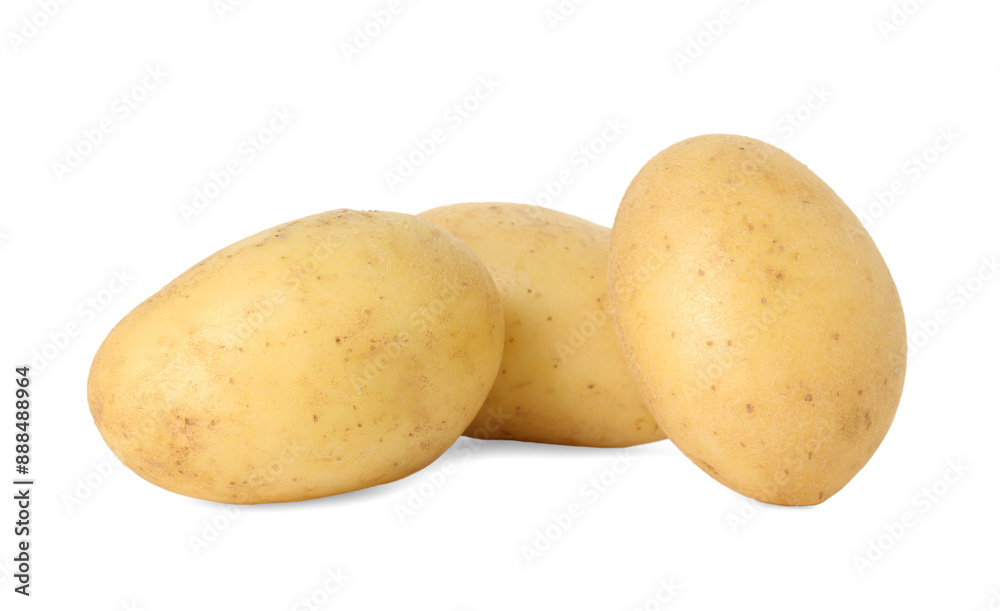 Three young fresh potatoes isolated on white Three young fresh potatoes isolated on white