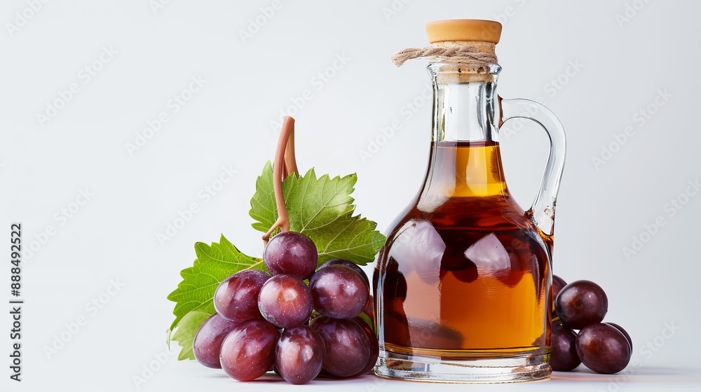 Vinegar and grapes isolated on a white background