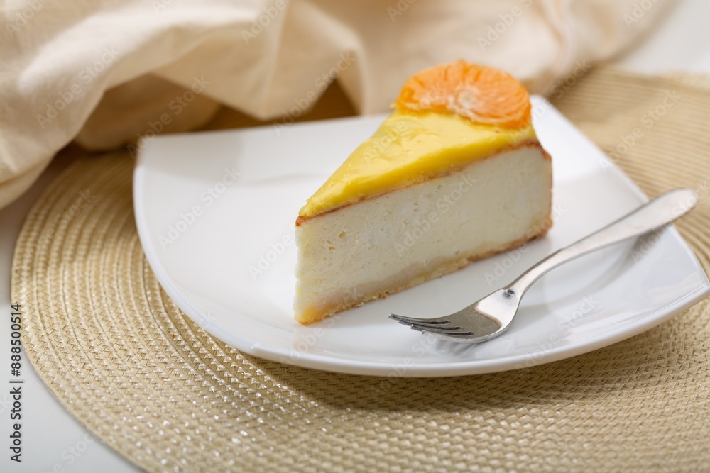 Delicious orange cheesecake with cream on plate Delicious orange cheesecake with cream on plate