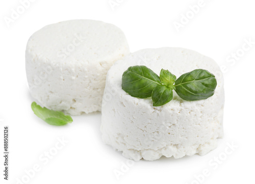 Fresh ricotta (cream cheese) and basil isolated on white