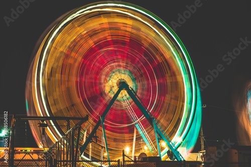 Long Exposure Ferris Wheel at a fair at night, amusement park, carnival