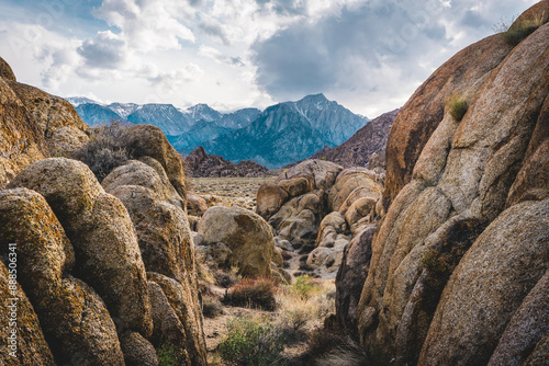Landscape of desert rocks, tall mountains in the distance, Alabama Hills, Inyo County, Lone Pine, California