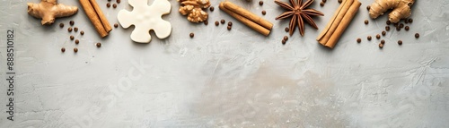 Spices and ingredients including cinnamon, star anise, and ginger on a textured surface, perfect for culinary and holiday-themed designs.