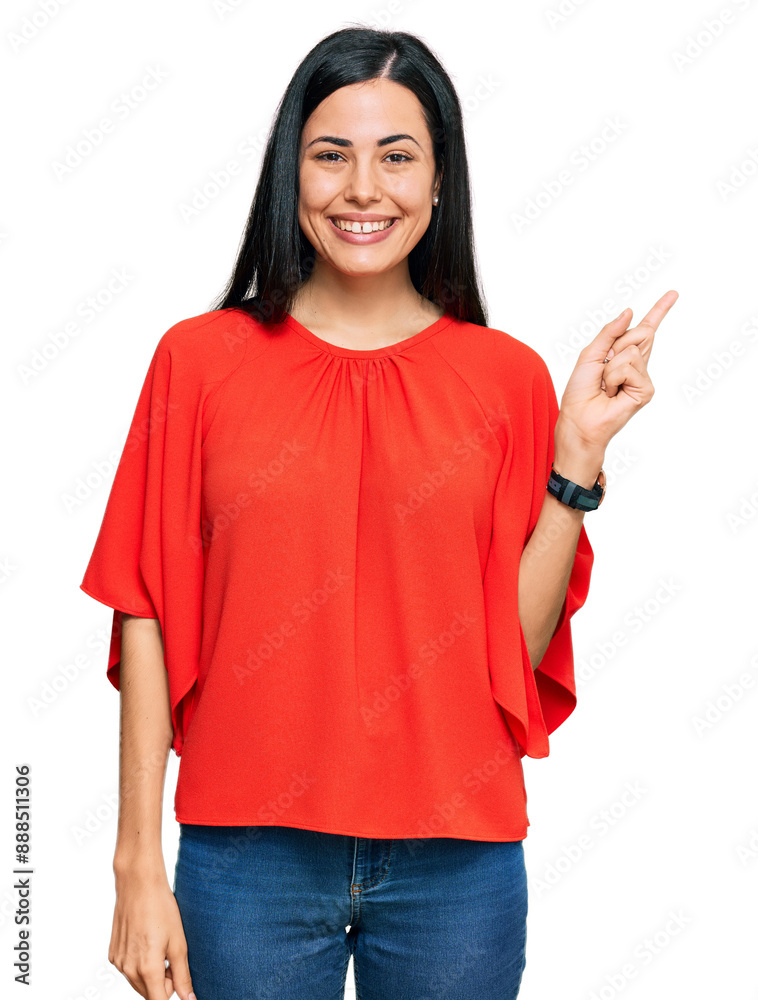 Beautiful young woman wearing casual clothes with a big smile on face, pointing with hand finger to the side looking at the camera. Beautiful young woman wearing casual clothes with a big smile on face, pointing with hand finger to the side looking at the camera.