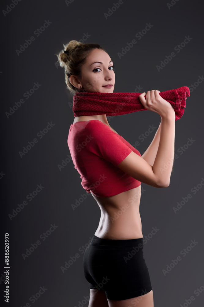 Sportswoman removing towel after fitness training Sportswoman removing towel after fitness training
